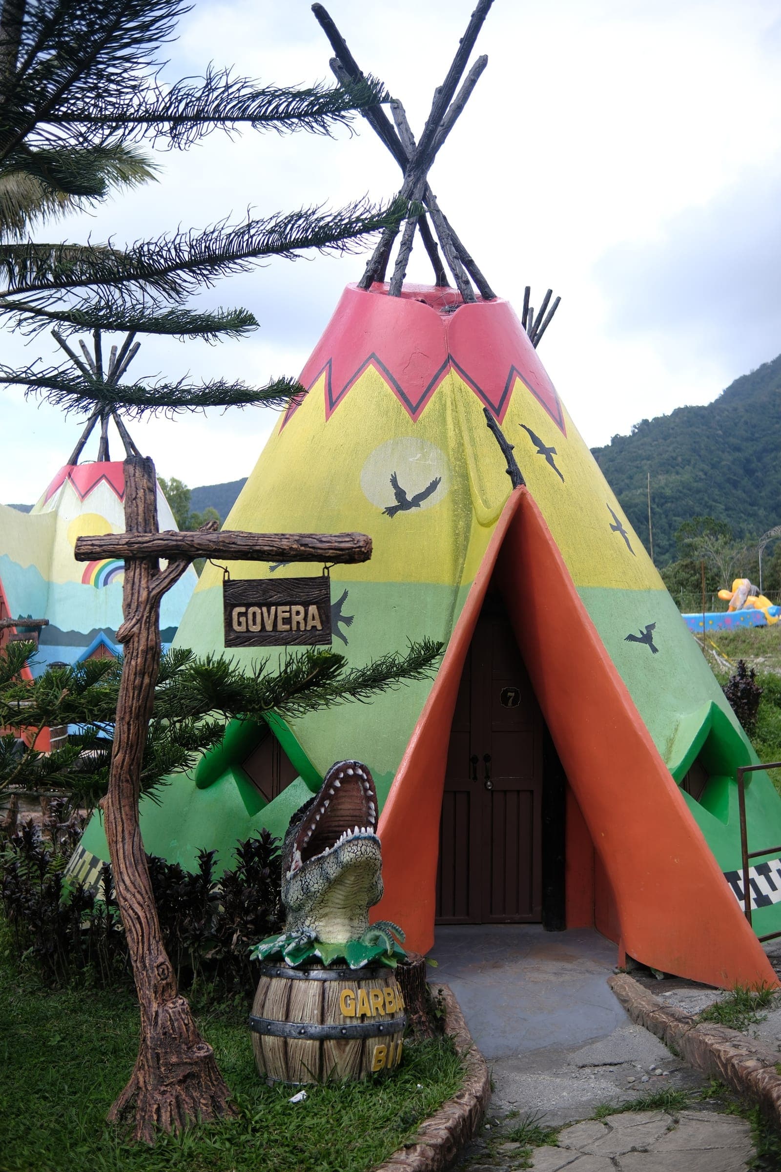 Teepee huts lit at dusk